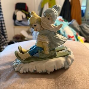 Charming Winter Sledding Figurine